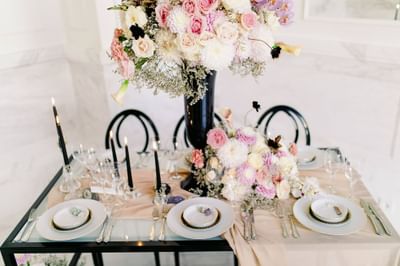 Table with Candles and Flowers at Polonia Palace Hotel Warsaw