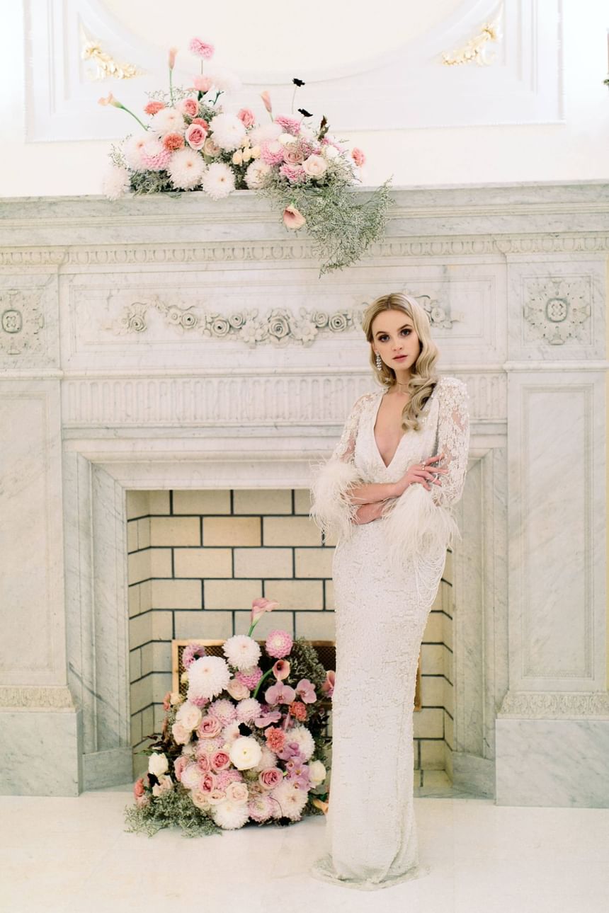 Lady standing near Flower Wall at Polonia Palace Hotel Warsaw